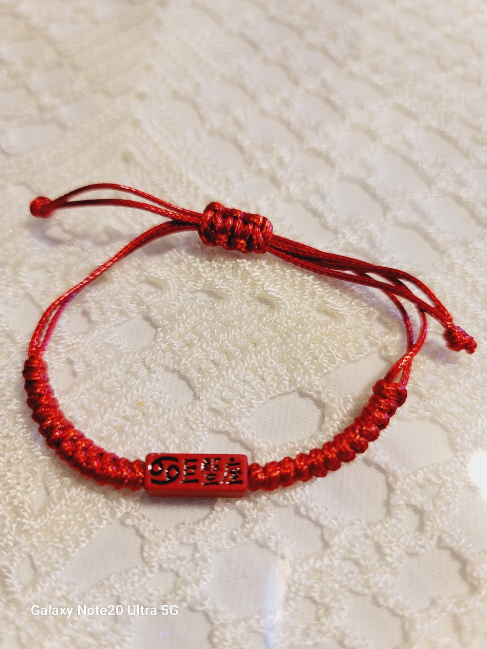 Red Adjustable Woven Bracelet with Decorative Charm
